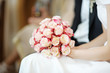 Bride holding flowers during the wedding ceremony Bride holding flowers during the wedding ceremony