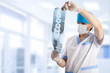 medical doctor looking at x-ray picture of spinal column in hosp medical doctor looking at x-ray picture of spinal column in hosp