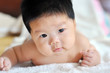 Photo: Baby lying on the bed Baby lying on the bed