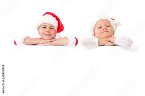 Foto: christmas girls with blank placard christmas girls with blank placard
