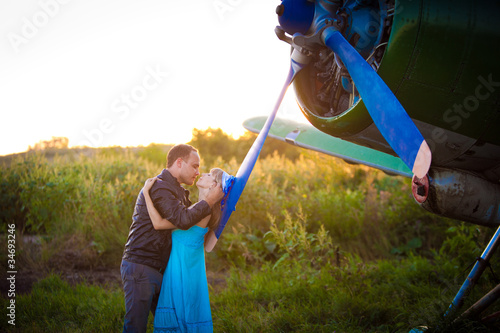 Photo: kissing under the vintage plane kissing under the vintage plane