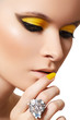 Beautiful model with bright fashion make-up, crystal ring