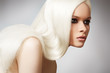 Portrait of beautiful model with straight shiny long blond hair