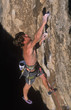 Photo: Rock climber dangles from the edge. Rock climber dangles from the edge.