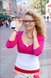 Young blonde woman with glasses