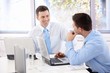 Handsome businessmen chatting in meeting room