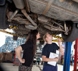 Mechanic Showing Customer Repairs