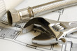 Plumbing tools over house blueprint