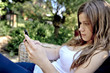 Photo: teenage girl with mobile cell phone outdoor teenage girl with mobile cell phone outdoor