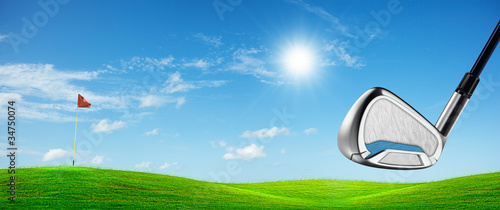 Photo: View of a golf course in sunny day. Panoramic composition. View of a golf course in sunny day. Panoramic composition.