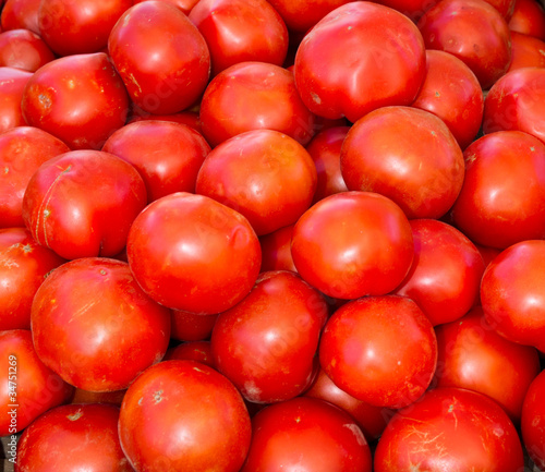 Photo: Red ripe tomatoes on display Red ripe tomatoes on display