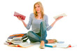 Photo: Confused teenager sitting on floor among schoolbooks Confused teenager sitting on floor among schoolbooks