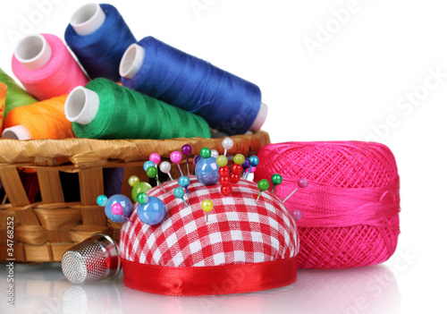 Photo: bright threads in basket and cushion for needles bright threads in basket and cushion for needles