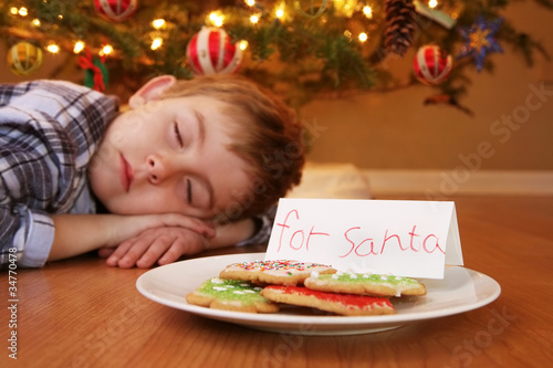Photo: Sleeping boy waiting for Santa Sleeping boy waiting for Santa
