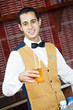 Cheerful arab barman