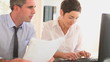 Video: Businesspartners in an office with papers Businesspartners in an office with papers
