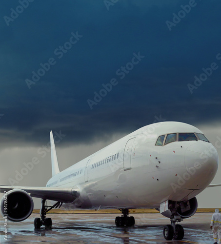 Photo: Airplane, delayed flight, rain storm, airport. Airplane, delayed flight, rain storm, airport.