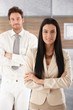 Pretty businesswoman smiling arms crossed