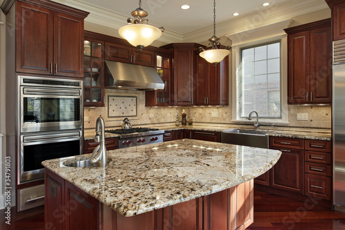 Photo: Kitchen with granite island Kitchen with granite island