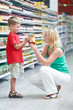 woman and boy making shopping