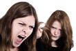 Two women fighting and pulling their hair