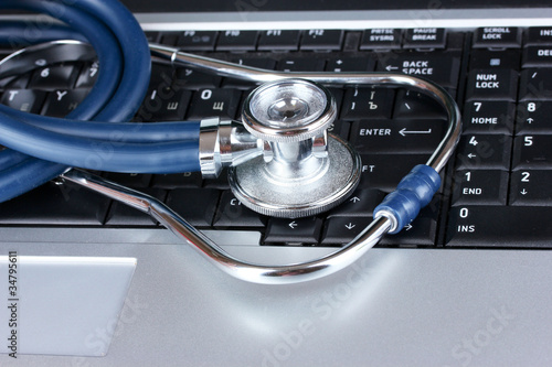 Photo: Medical stethoscope and notebook Medical stethoscope and notebook