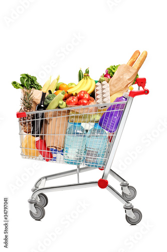 Photo: A shopping cart full with groceries A shopping cart full with groceries