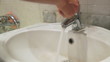 Washing hands in washbowl