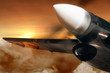 Airplane in sunrise sky. Trough times ahead future.