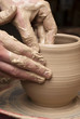 hands of a potter, creating an earthen jar on the circle hands of a potter, creating an earthen jar on the circle