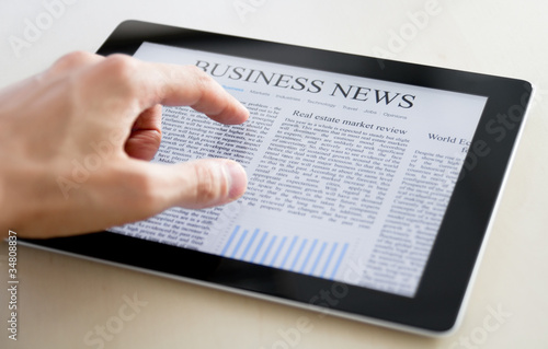 Photo: Business News On Tablet PC Business News On Tablet PC