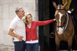 A middle-aged couple standing at Horse Guards