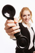 Businesswoman holding up telephone receiver