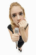 Woman biting her fingernails while holding microphone