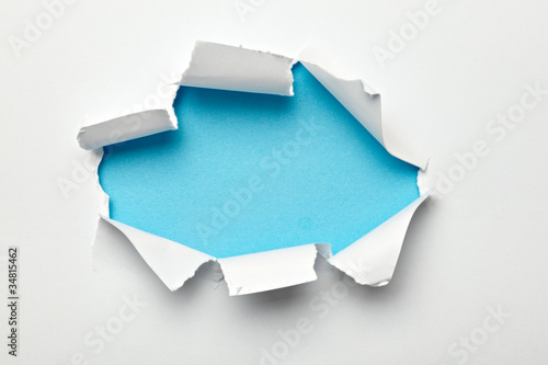 Photo: paper hole ripped destroyed damaged exploding paper hole ripped destroyed damaged exploding