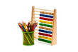 Abacus and pencils isolated on white