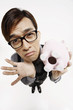 Businessman with empty piggy bank looking sad