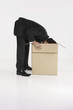 Businessman looking into a box