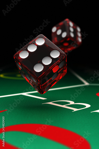 Photo: Two dice over craps table with selective focus Two dice over craps table with selective focus