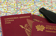 EU passports on a map and a car key
