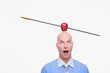 Man with apple pierced by arrow balanced on his head