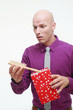 Man taking out a hair brush from gift box