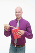 Man taking out a hair brush from gift box