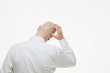 Businessman scratching his head