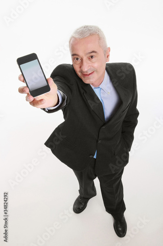 Photo: Businessman showing his smart phone Businessman showing his smart phone