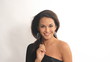 Portrait of pretty hispanic woman dancing in studio