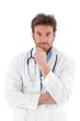 Photo : Young doctor looking questioningly