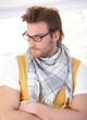 Young man in glasses looking away