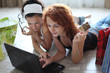 Two pretty girls shopping over internet