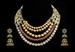 Close up of diamond necklace with diamond ear ring